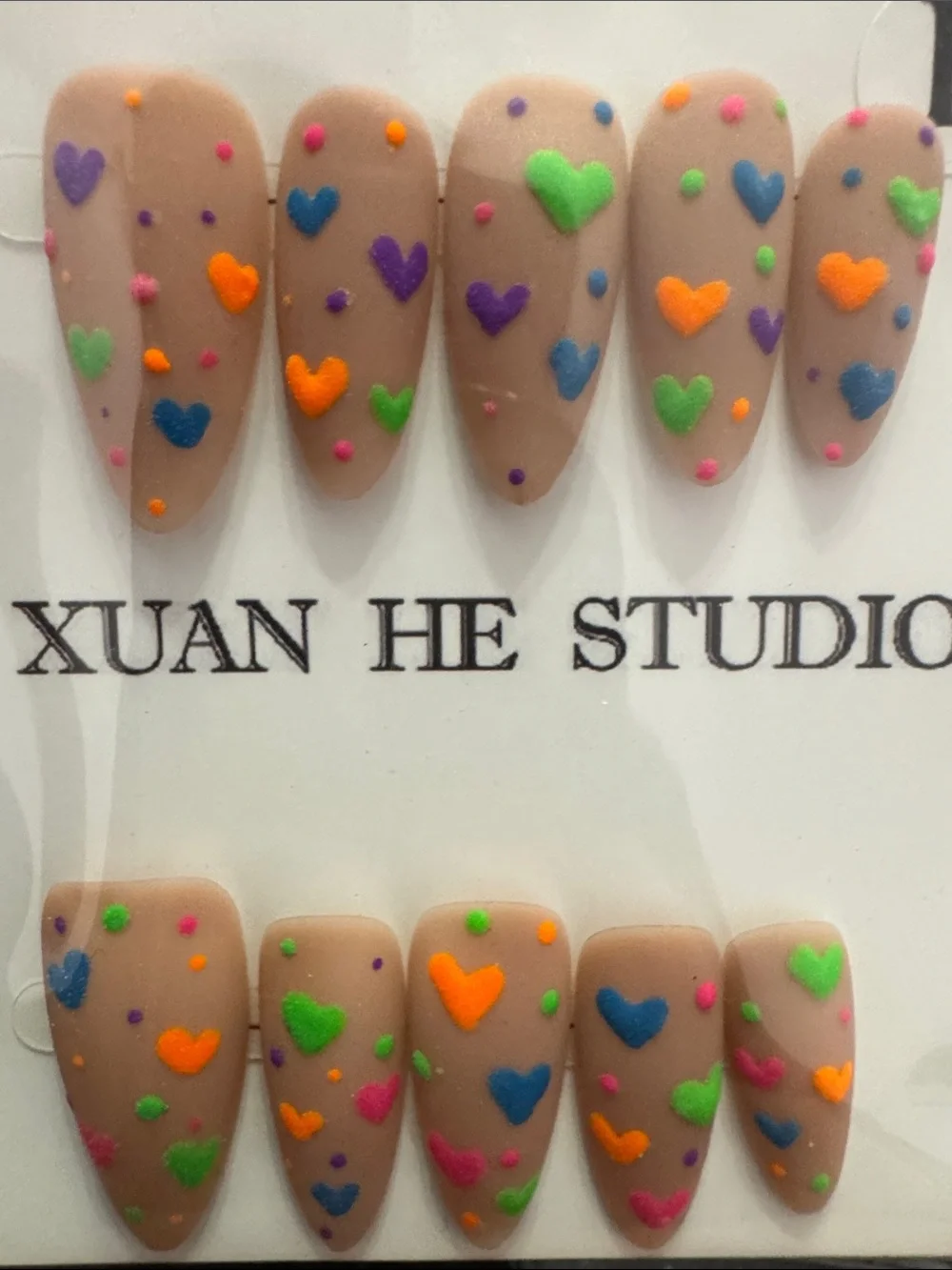 Nude Matte Press-On Nails with Neon Heart Accents